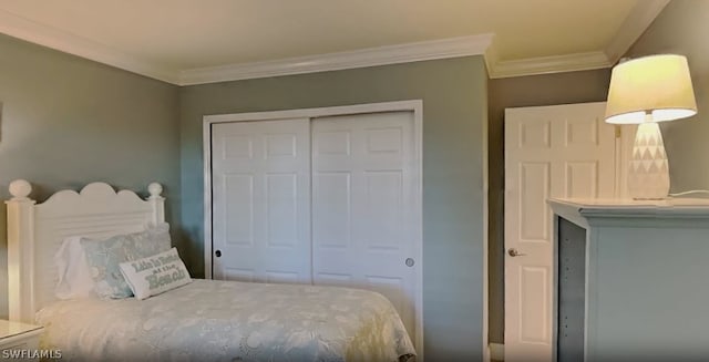 bedroom featuring ornamental molding and a closet