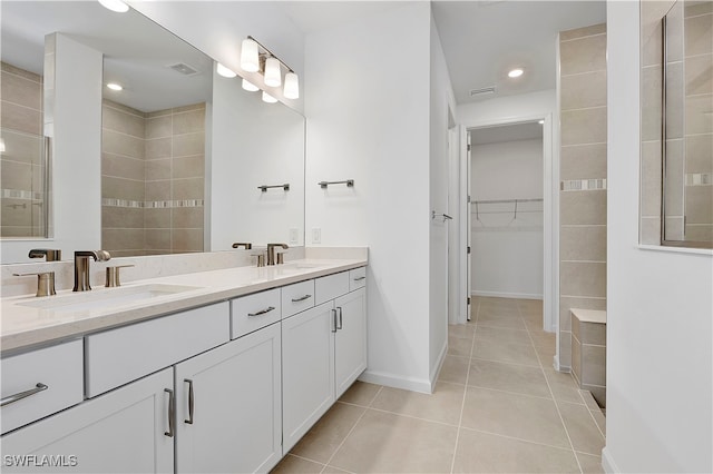 bathroom featuring tile patterned flooring and vanity