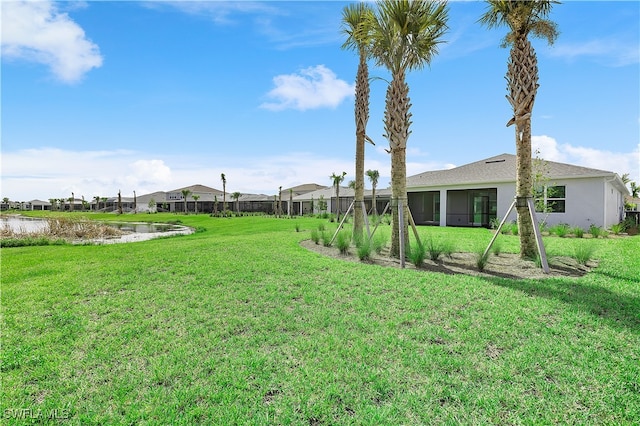 view of yard featuring a sunroom