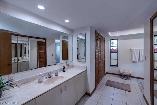 bathroom with vanity and tile flooring