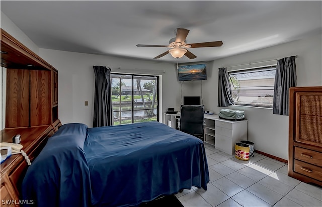 tiled bedroom with ceiling fan