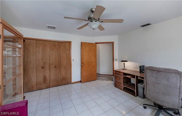 tiled office featuring ceiling fan