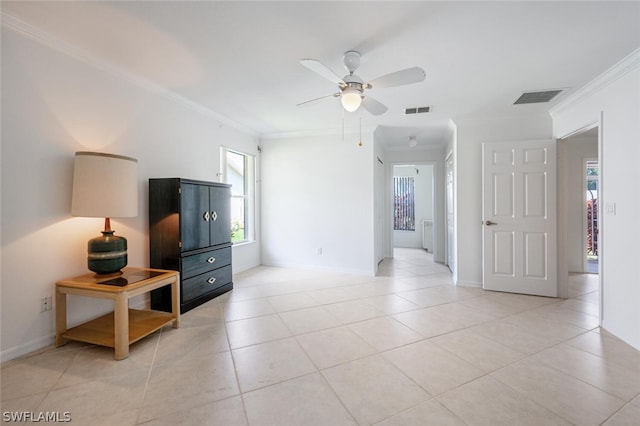 tiled living room with crown molding and ceiling fan