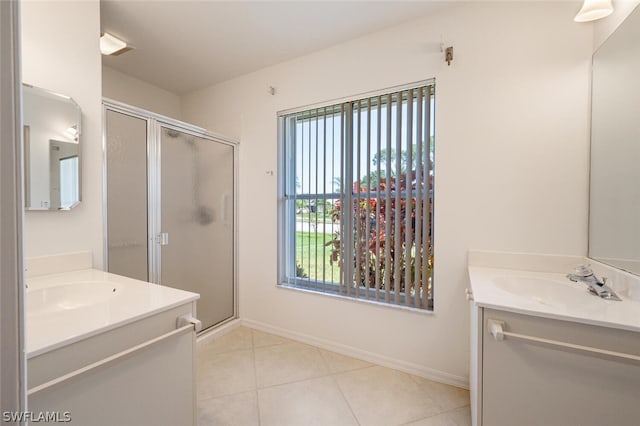 bathroom featuring a shower with shower door, tile flooring, and large vanity