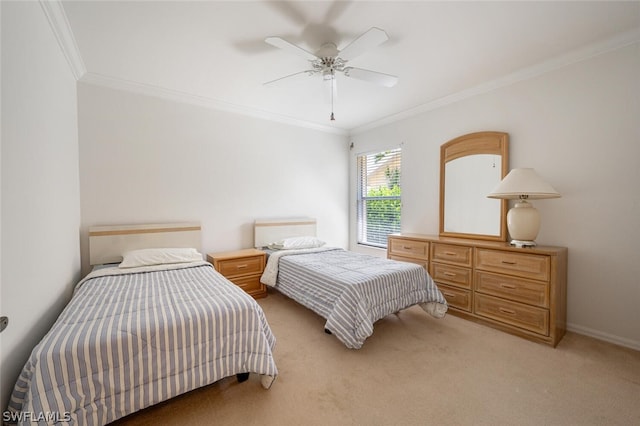 carpeted bedroom with ceiling fan and ornamental molding