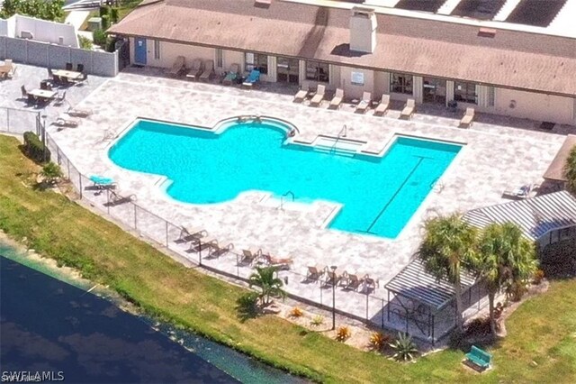 view of swimming pool featuring a patio area