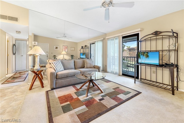 living room featuring light colored carpet and ceiling fan