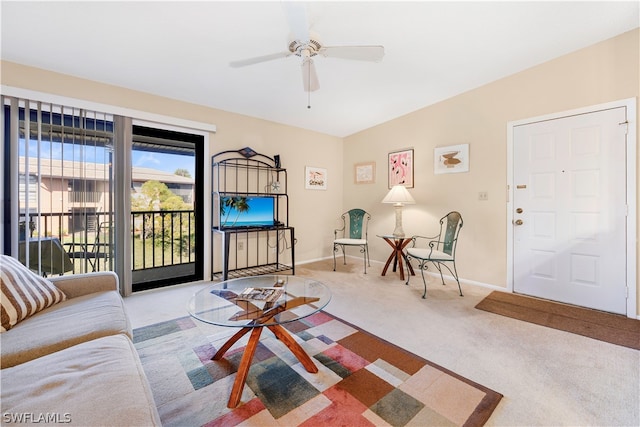 living room with light carpet and ceiling fan