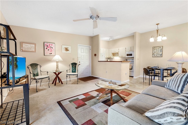 carpeted living room featuring ceiling fan with notable chandelier