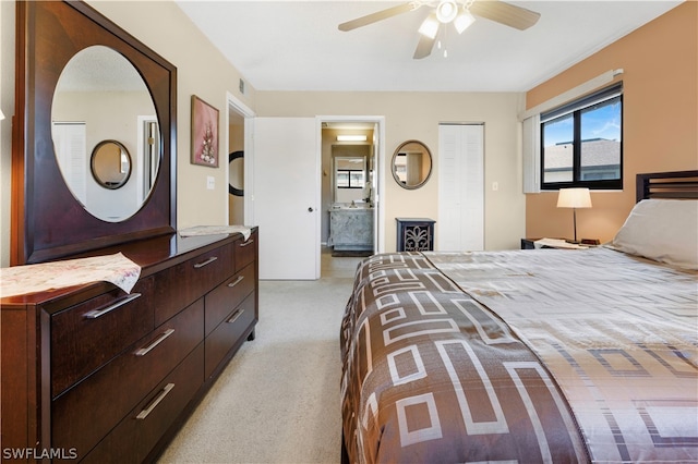 carpeted bedroom with connected bathroom and ceiling fan