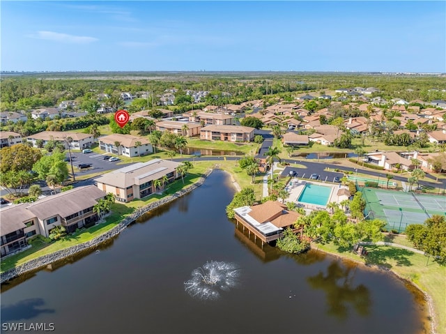 birds eye view of property with a water view