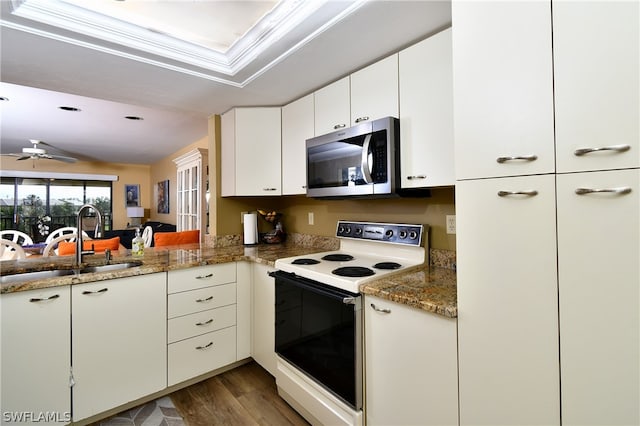 kitchen featuring electric stove, ceiling fan, white cabinets, stone countertops, and hardwood / wood-style flooring