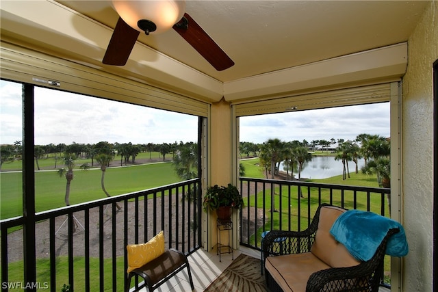 exterior space with a water view and ceiling fan