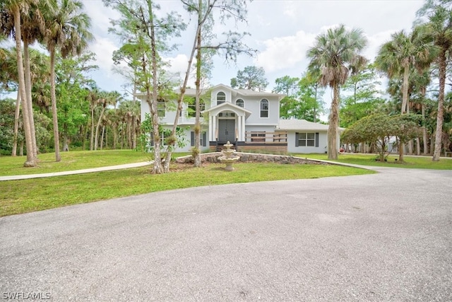 view of front facade with a front yard