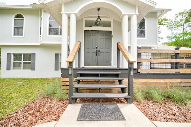 view of exterior entry featuring a porch