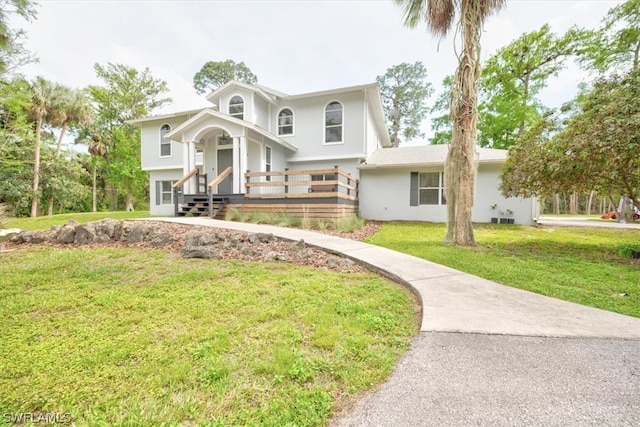 view of front facade with a front lawn