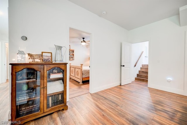 interior space featuring light hardwood / wood-style floors and ceiling fan