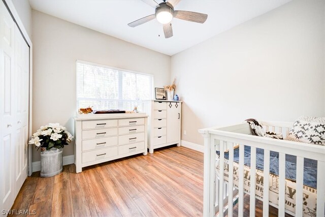 bedroom featuring a closet, ceiling fan, and light wood-type flooring