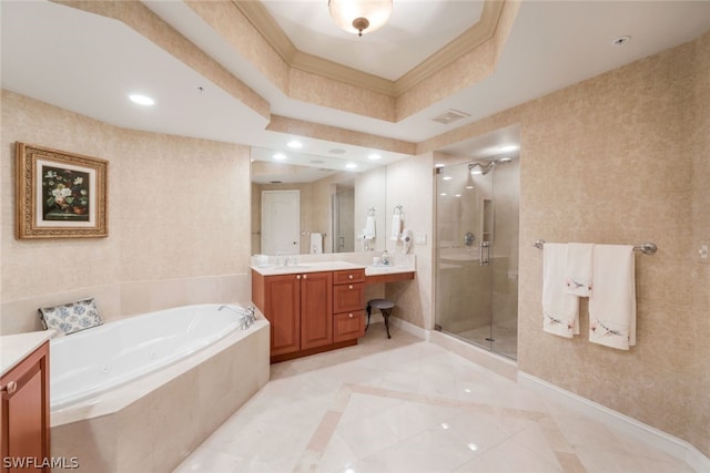 bathroom featuring tile patterned flooring, shower with separate bathtub, vanity, and a tray ceiling