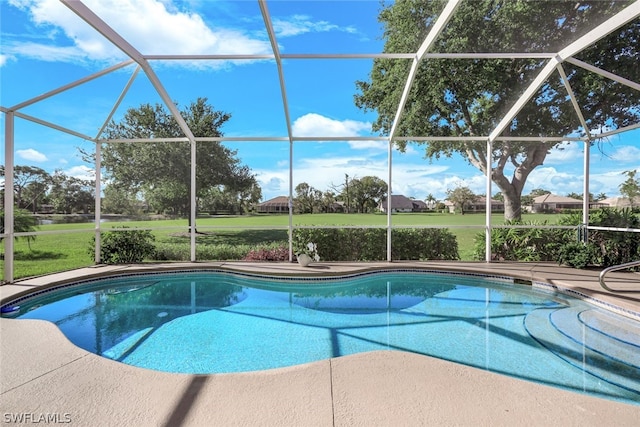 view of swimming pool featuring glass enclosure