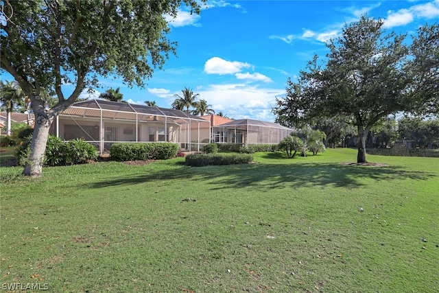 view of yard with a lanai