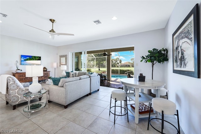 living room featuring ceiling fan and light tile patterned floors