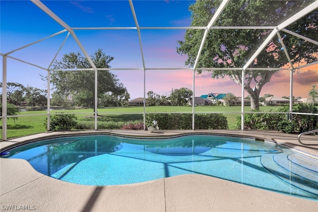 pool at dusk with a lanai