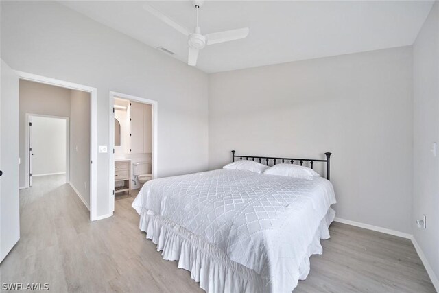 bedroom featuring ensuite bath, ceiling fan, and light hardwood / wood-style floors