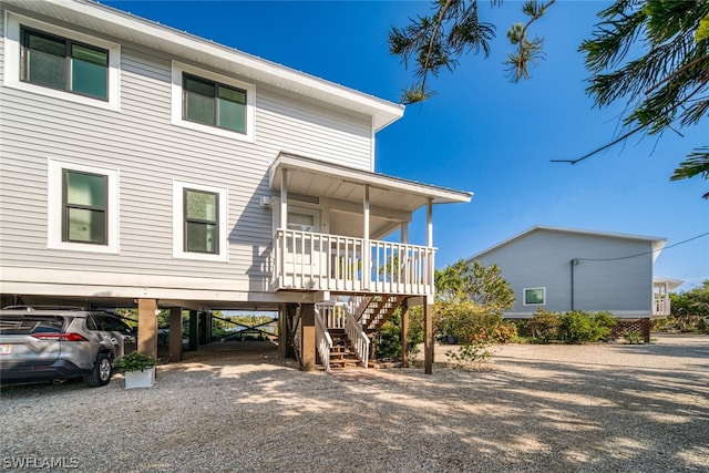 raised beach house with a carport