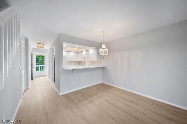 unfurnished living room featuring light hardwood / wood-style floors