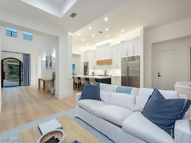 living room featuring a fireplace and light hardwood / wood-style flooring