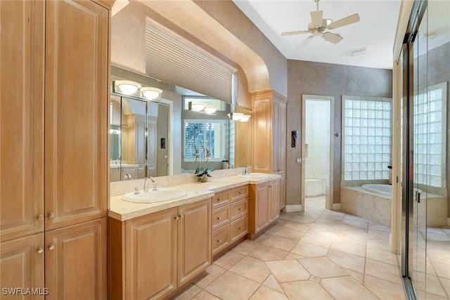 bathroom with vanity, ceiling fan, tile patterned floors, and independent shower and bath