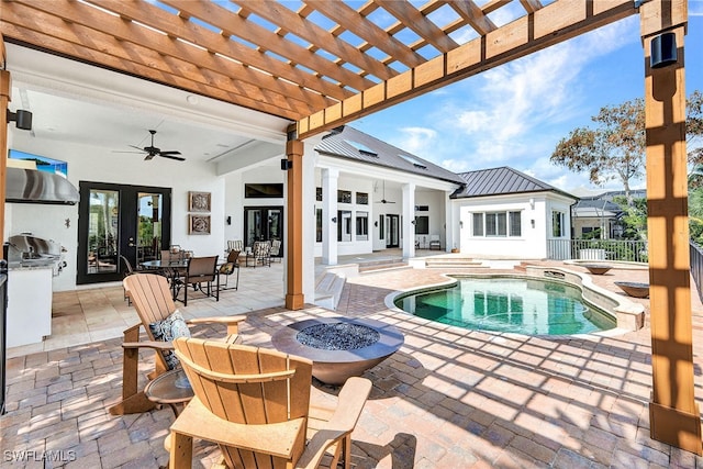 view of swimming pool featuring a hot tub, ceiling fan, a patio, a pergola, and french doors