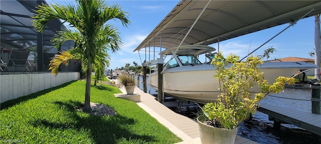 view of yard featuring a water view and a boat dock