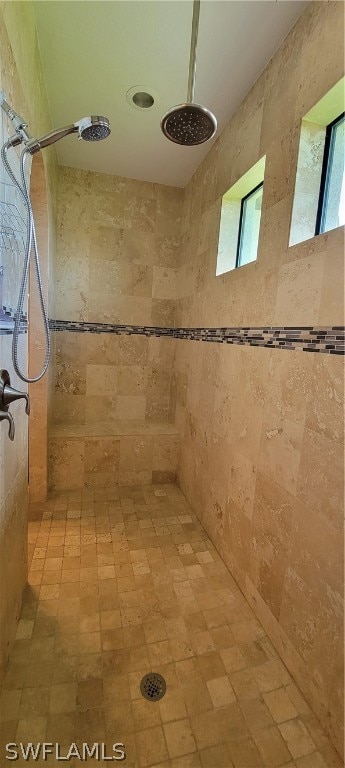 bathroom with a tile shower