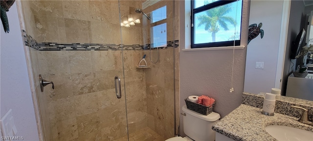 bathroom featuring vanity, walk in shower, a chandelier, and toilet