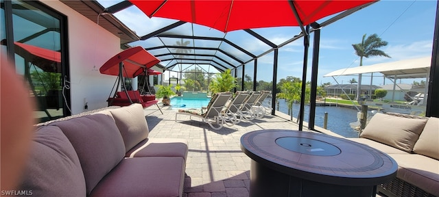 sunroom with vaulted ceiling and a water view