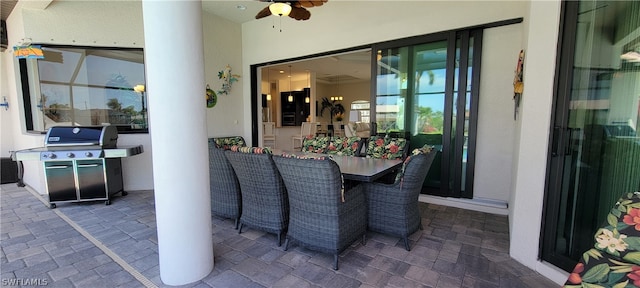 view of terrace with grilling area and ceiling fan