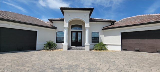 mediterranean / spanish-style home with a garage