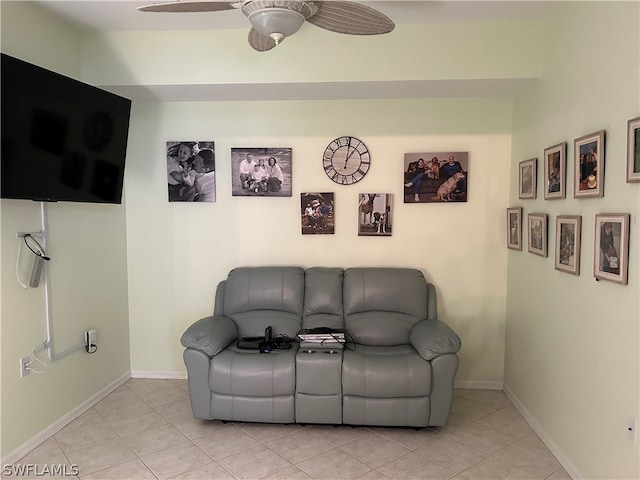 living room featuring light tile floors and ceiling fan