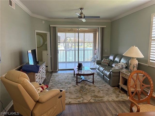 living room featuring ornamental molding, ceiling fan, and dark hardwood / wood-style flooring