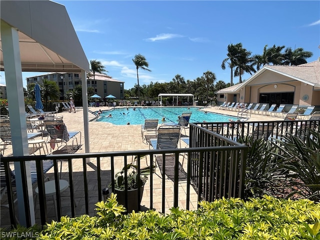 view of swimming pool with a patio area