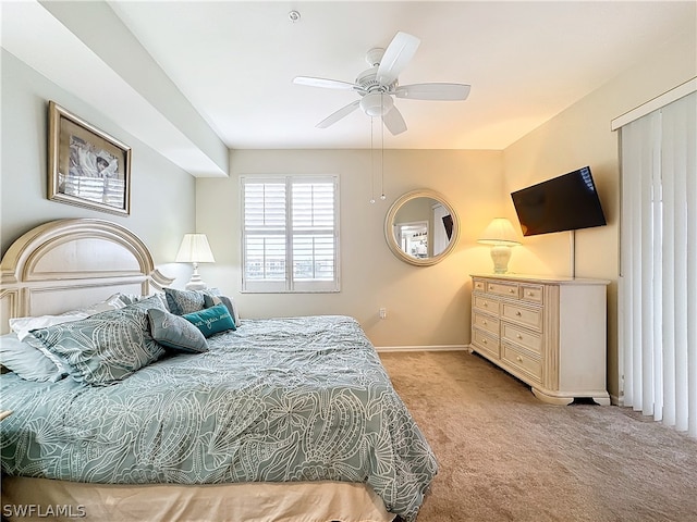 bedroom with light carpet and ceiling fan