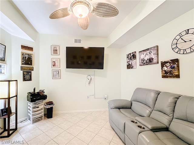 tiled living room with ceiling fan