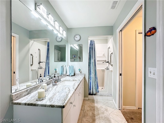 bathroom featuring vanity and tile flooring