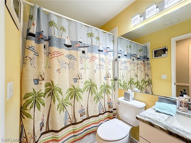 bathroom with vanity and toilet