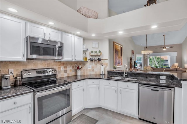 kitchen featuring a sink, white cabinets, and appliances with stainless steel finishes