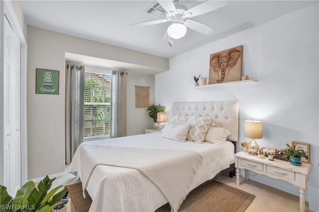 bedroom with ceiling fan and baseboards