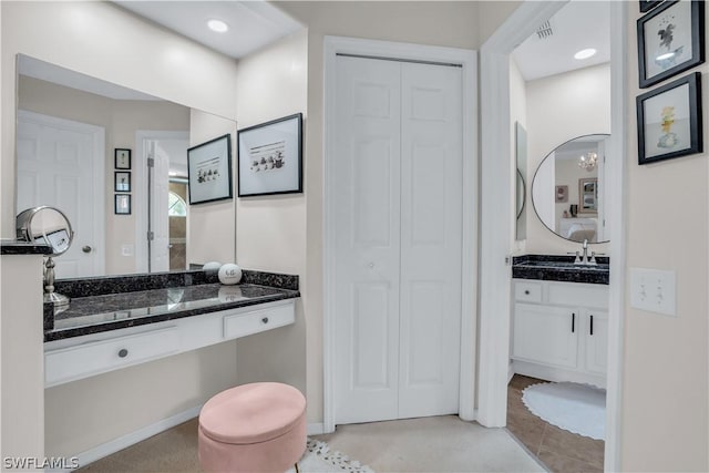 full bath featuring vanity, visible vents, a closet, and tile patterned floors