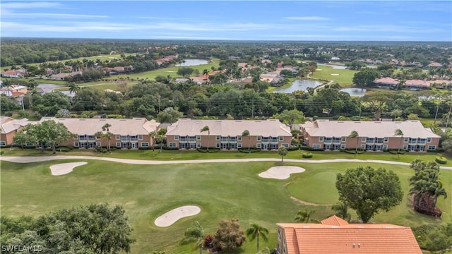 drone / aerial view with a residential view, a water view, and golf course view